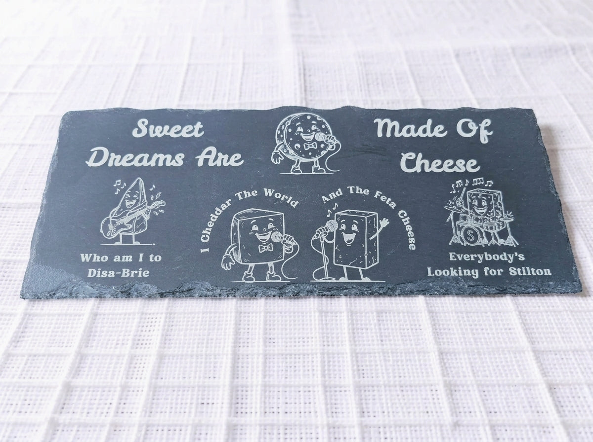 Rectangular slate board engraved with cartoon cheese band characters and funny cheese pun lyrics.