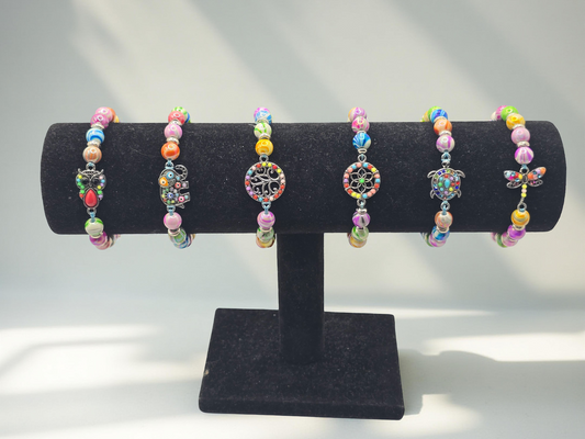 Kids beaded bracelet, multicoloured elastic bracelet with various colourful charms
