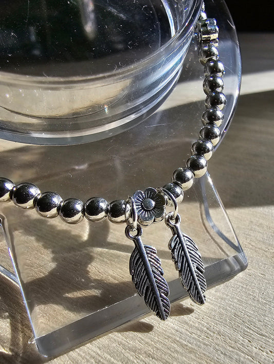 Feather and Flower Silver Beaded Bracelet - Silver beaded chain with daisy beads and leaf charms