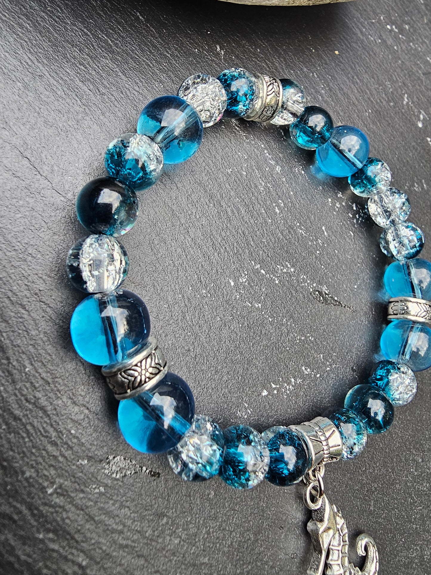 Seahorse charm beaded bracelet - Blue and clear glass beads and elasticated band to fit most wrist sizes