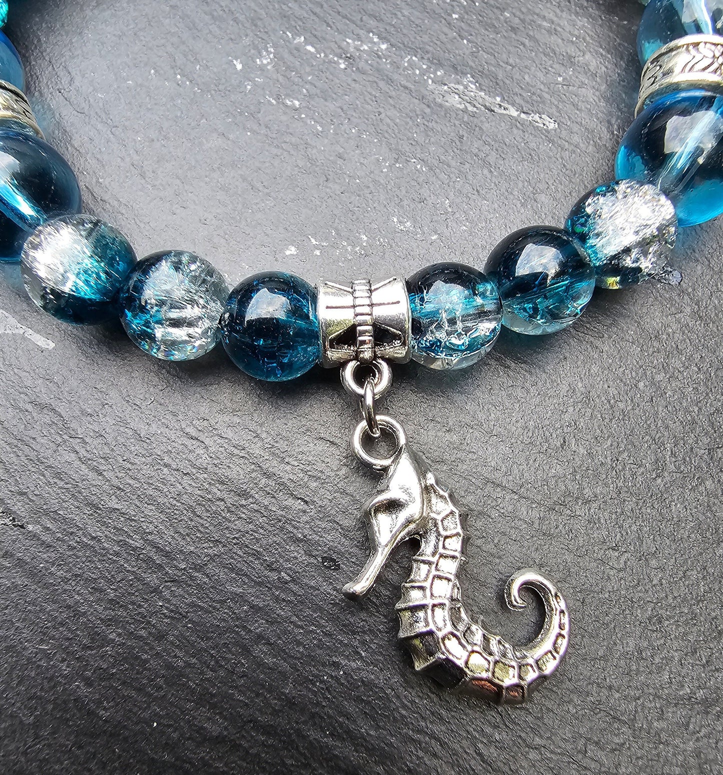 Seahorse charm beaded bracelet - Blue and clear glass beads and elasticated band to fit most wrist sizes