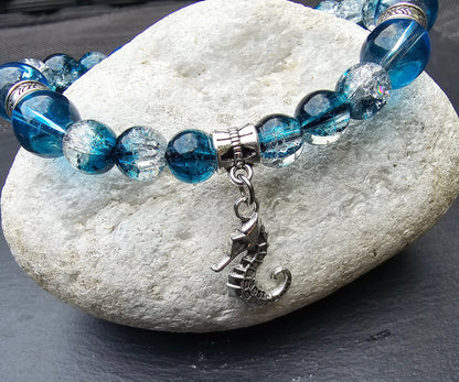 Seahorse charm beaded bracelet - Blue and clear glass beads and elasticated band to fit most wrist sizes