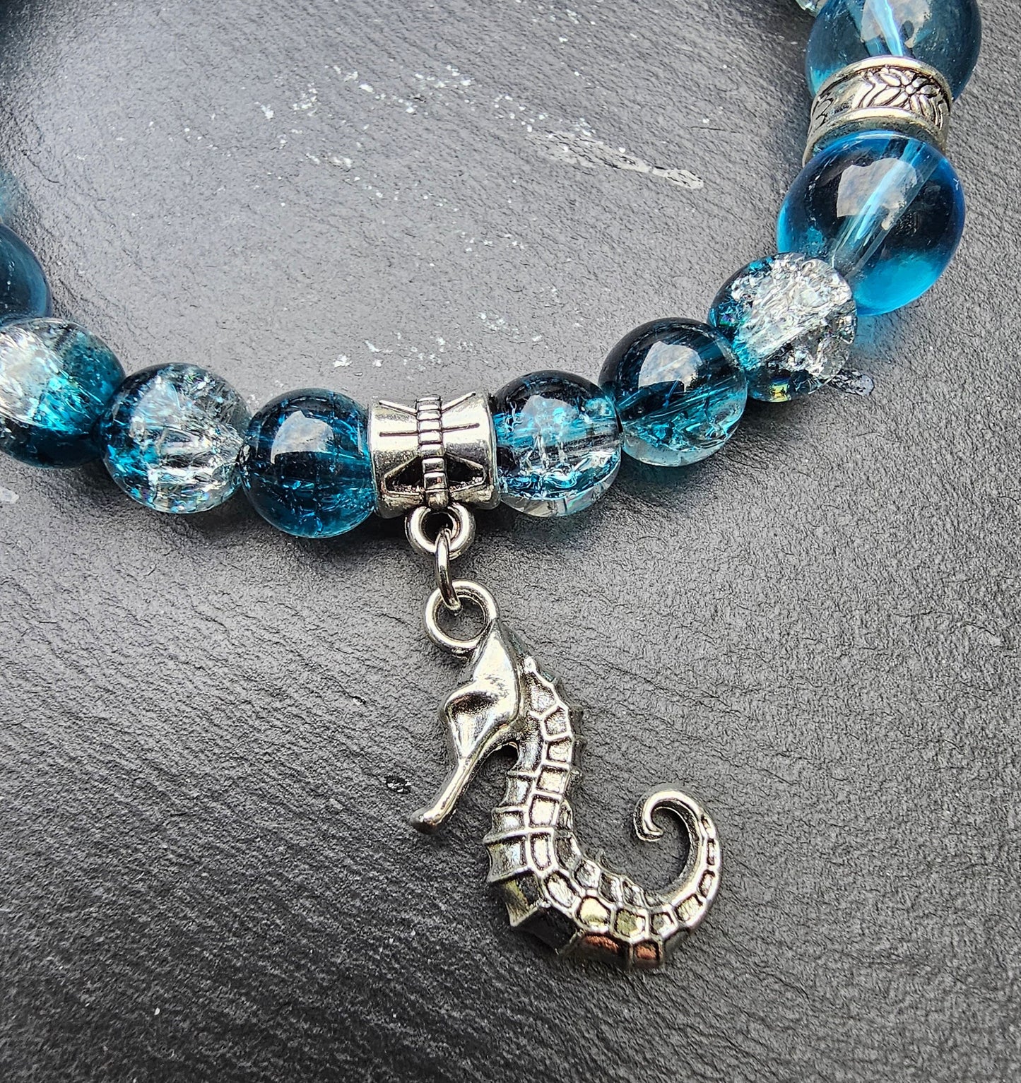 Seahorse charm beaded bracelet - Blue and clear glass beads and elasticated band to fit most wrist sizes
