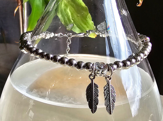 Feather and Flower Silver Beaded Bracelet - Silver beaded chain with daisy beads and leaf charms
