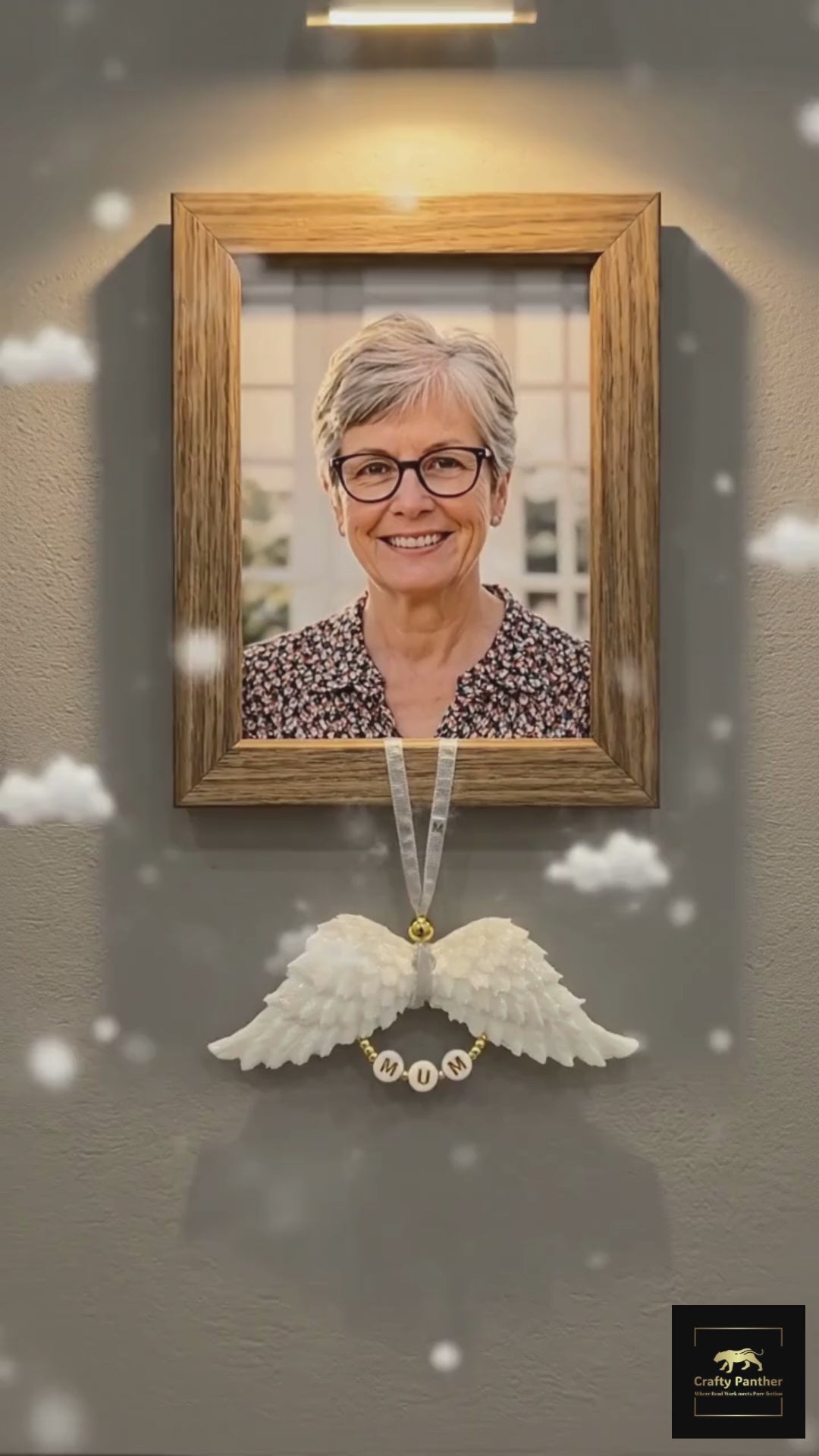 White resin angel wing with mum lettering hangs from a portrait picture of a lady